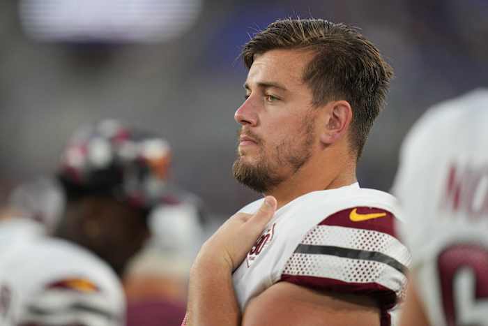 Washington Commanders center Chase Roullier (73) watches the game against the Baltimore Ravens during the first quarter at M&T Bank Stadium.